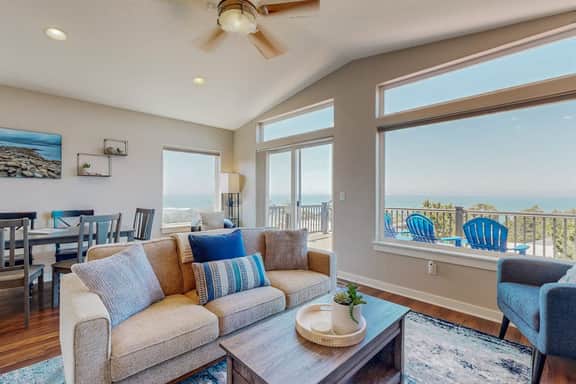 Sweeping ocean view home with fireplace grill and foosball table dog friendly
