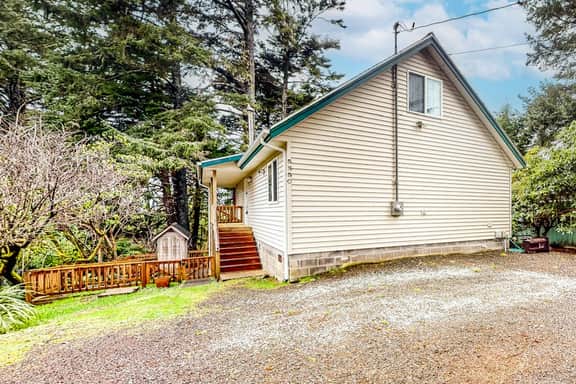 Renovated three story home by the beach with a furnished deck and washer dryer
