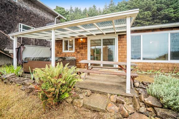 Cozy dog friendly home with ocean views a private hot tub and washer and dryer