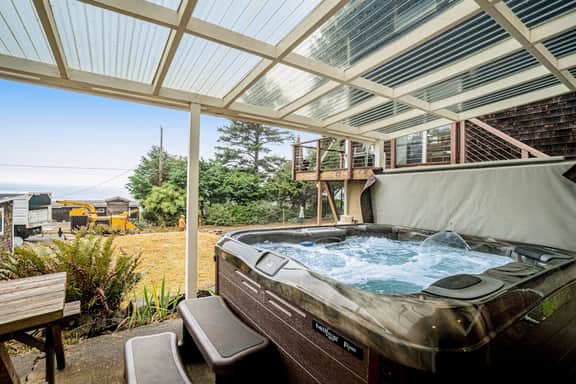 Cozy dog friendly home with ocean views a private hot tub and washer and dryer
