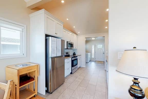 Beachfront home with ocean facing deck and ocean views throughout modern kitchen - Image 5