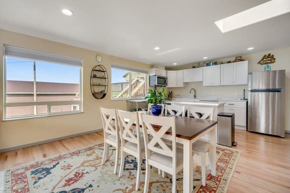 Light filled home in the heart of town with deck and with D steps to beach access