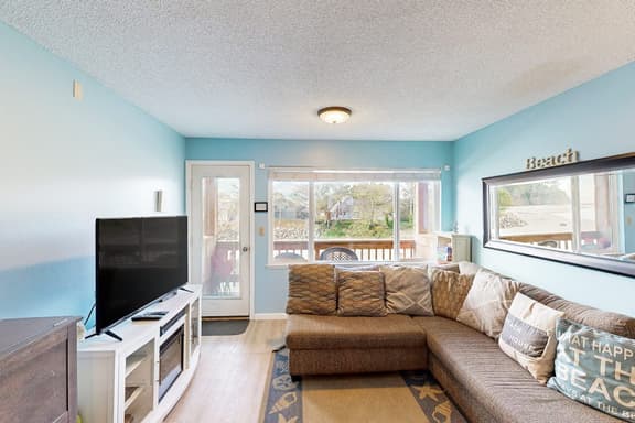 Creekside condo with beach access balcony full kitchen and ocean views