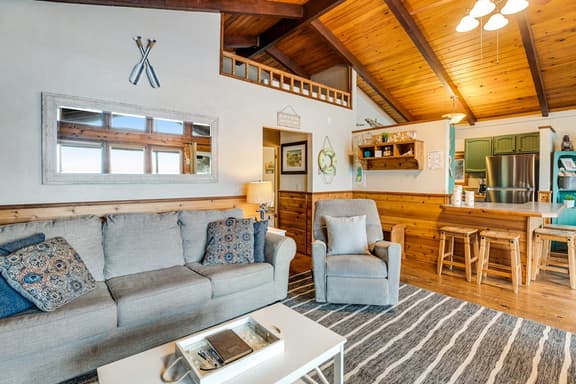 Rustic waterfront woodland lodge with impressive lake views from patio