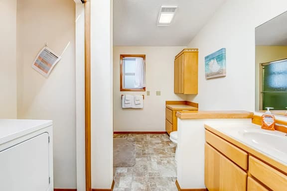 Two story oceanfront retreat with a washer dryer firepit and Ping Pong table