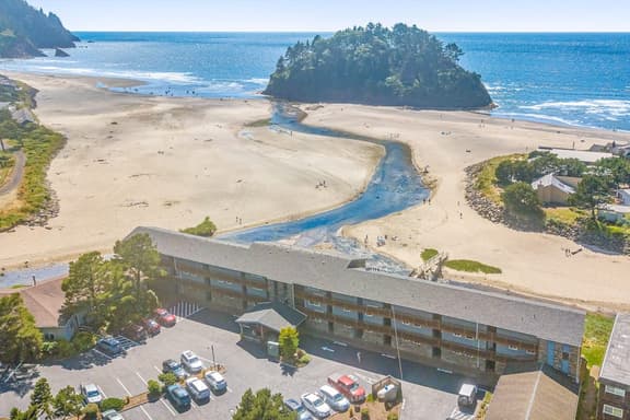 Creekfront Condo with Private Patio Beach Access Shared with D Gas Grill and Views