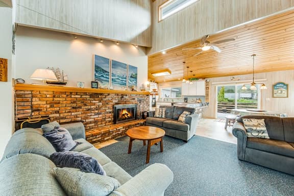 Spacious family home with ocean view balcony deck and fireplace dogs OK